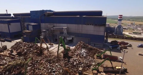 Several cranes unload scrap from trucks, view from above, cover shot Stock Footage 73186151