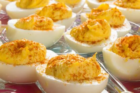 Several Deviled Eggs topped with paprika Stock Photos