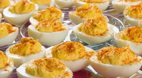 Several Deviled Eggs topped with paprika Stock Photos