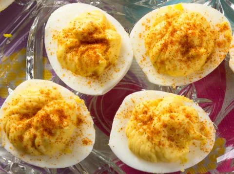 Several Deviled Eggs topped with paprika Stock Photos