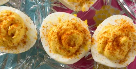 Several Deviled Eggs topped with paprika Stock Photos
