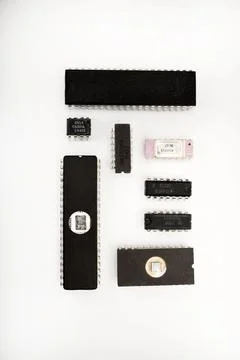 Several different chips on a white background. Old electronic chips. Stock Photos