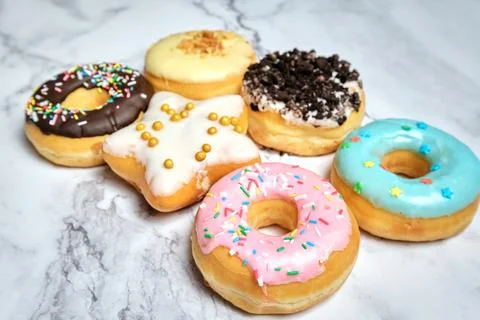 Several different donuts on a white background 스톡 사진