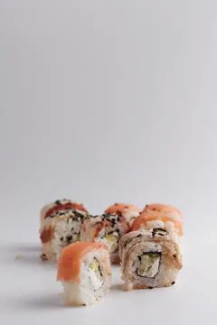 Several different rolls on the table, Asian food, side view, light background Stock Photos