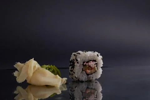 Several different rolls on the table, asian food, side view, dark background Stock Photos