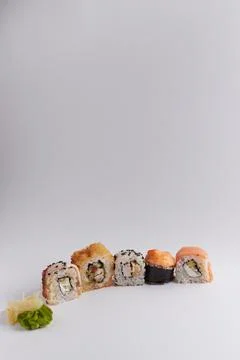 Several different rolls on the table, Asian food, side view, light background Stock Photos