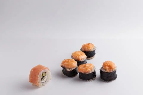 Several different rolls on the table, Asian food, side view, light background Stock Photos