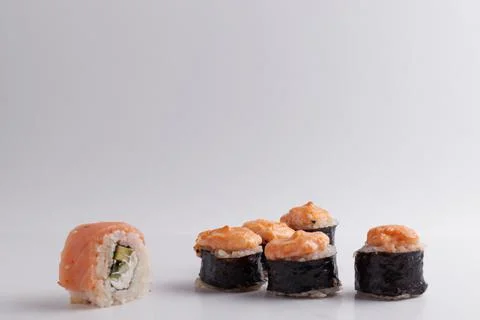 Several different rolls on the table, Asian food, side view, light background Stock Photos