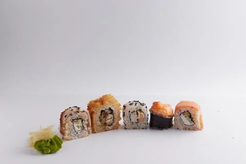 Several different rolls on the table, Asian food, side view, light background Stock Photos