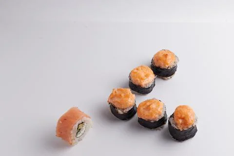 Several different rolls on the table, Asian food, side view, light background Stock Photos