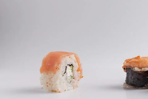 Several different rolls on the table, Asian food, side view, light background Stock Photos