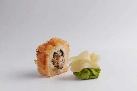 Several different rolls on the table, Asian food, side view, light background Stock Photos
