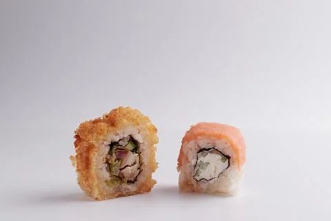Several different rolls on the table, Asian food, side view, light background Stock Photos