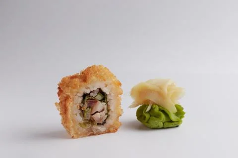 Several different rolls on the table, Asian food, side view, light background Stock Photos