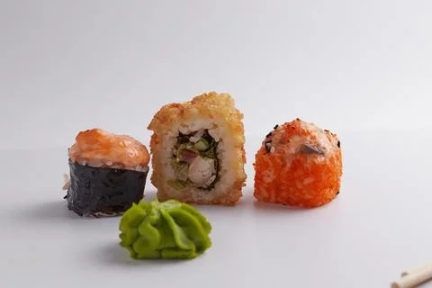Several different rolls on the table, Asian food, side view, light background Stock Photos