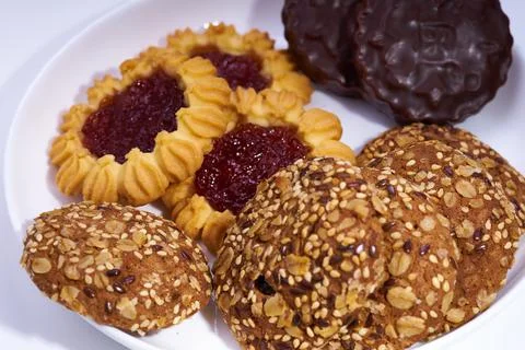 Several different types of cookies for breakfast on a plate selective fokus Stock Photos