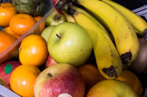 Several different types of fresh slightly spoiled fruits found in the local o Stockfoto's