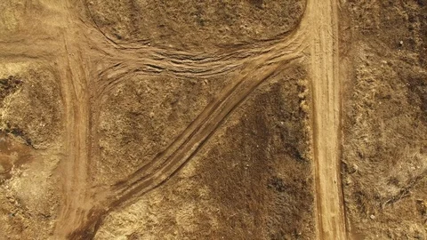 Several dirt roads forming a pattern in a desert-like area (4k drone footage) Stock Footage 89020914