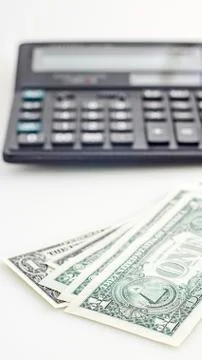 Several dollars and calculator 스톡 사진