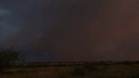 Several dramatic lightning bolts strike down from a close by thunderstorm. Video stock 11406927