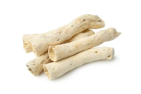 Several dried roots on white background. Stock Photos
