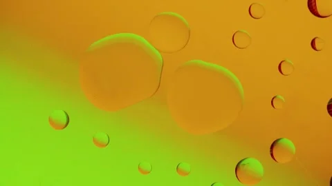 Several drops join together on a yellow-green gradient background. Stockbeeldmateriaal 303058957