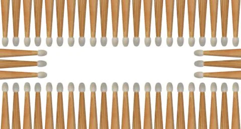 Several drumsticks isolated on white creates an abstract background pattern. Stock Photos