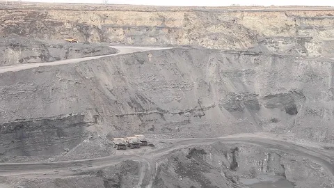 Several dump trucks in coal open pit Stock Footage 83390309