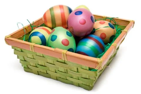 Several Easter Eggs in a Basket Isolated on a White Background Stockfoto's