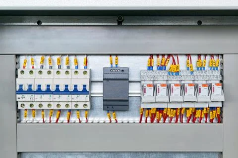 Several electrical circuit breakers, power supply and intermediate relays. Stock Photos