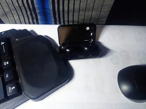 Several electronic devices such as mouse, earphones. Stock Photos