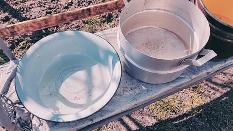 Several empty pans. large pots of water. many colorful pots. Stock Photos