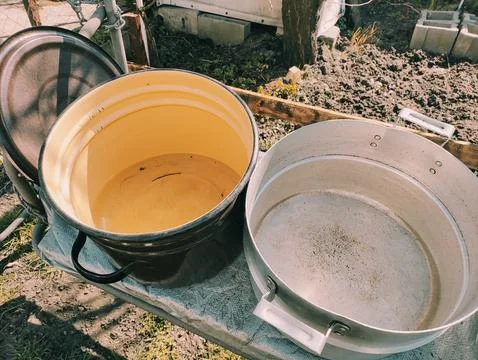 Several empty pans. large pots of water. many colorful pots. Stock Photos