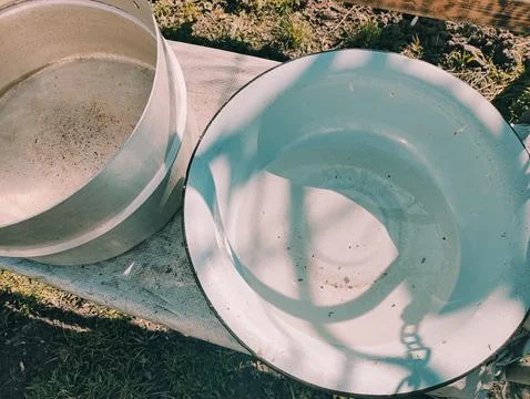Several empty pans. large pots of water. many colorful pots. Stock Photos