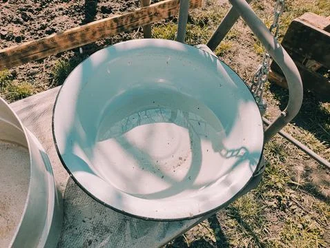 Several empty pans. large pots of water. many colorful pots. Stock Photos