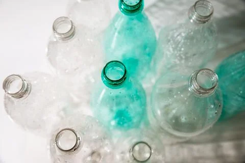 Several empty plastic bottles with water drops. ecology, recycling Stock Photos