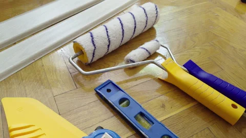 Several essential tools for renovating interior walls. Tools placed on the floor Stock Footage 282399718