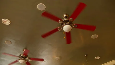 Several fans hang on the ceiling in a cafe, camera movement Stock Footage 135383478