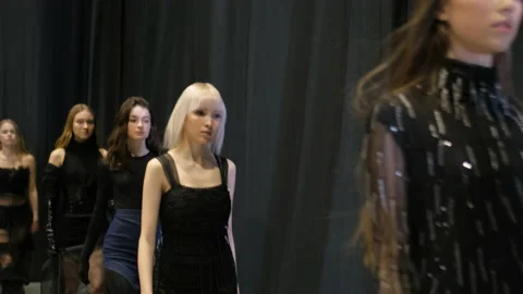 Several female models walking in row on fashionable luxury vogue show runway. Stock Footage 160248856