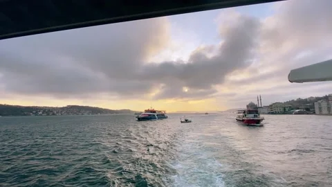 Several ferries in the Bosphorus against the backdrop of a beautiful dramatic Video stock 203970740