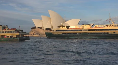 Several ferries pass by the Sydney Opera House Stock Footage 52845698
