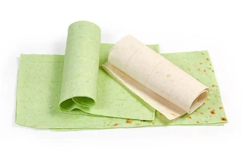 Several folded, twisted thin ordinary lavash and lavash with spinach Stock Photos
