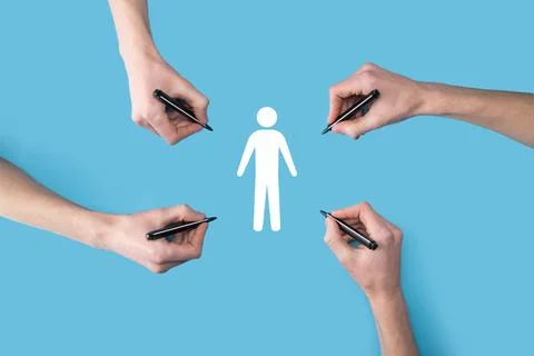 Several, four hands draw a man people human icon with a marker.HR Human ,peop Stockfoto's