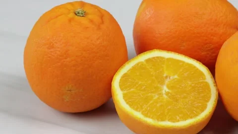 Several fresh oranges, close-up, on a table Stock Footage 261733553