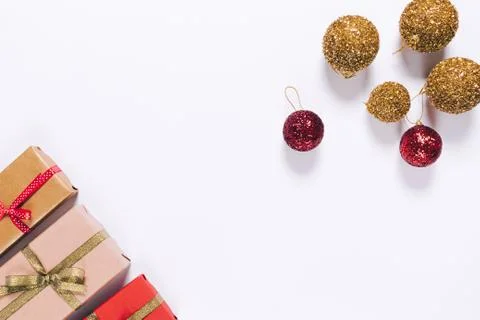 Several gift boxes in wrapping paper with ribbon and Christmas balls Fotos Stock