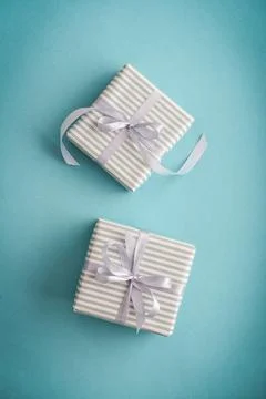 Several gift striped boxes with grey ribbon Stock Photos