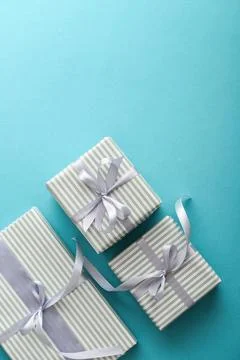 Several gift striped boxes with grey ribbon Stock Photos