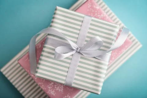 Several gift striped boxes with grey ribbon Stock Photos