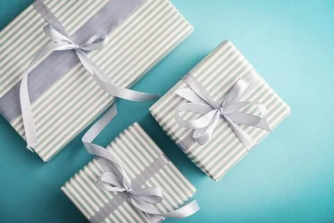 Several gift striped boxes with grey ribbon Stock Photos