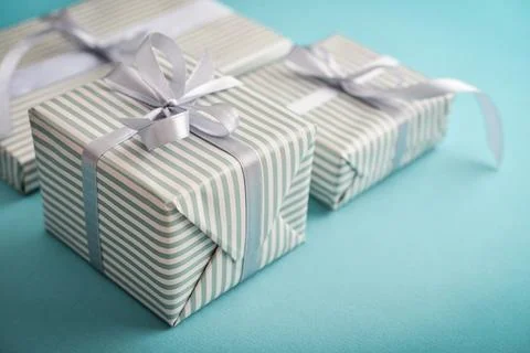 Several gift striped boxes with grey ribbon Stock Photos